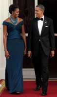 President Barack Obama and first lady Michelle Obama welcome Britain's Prime Minister David Cameron, Wednesday, March 14, 2012, in Washington. (AP Photo/Susan Walsh)